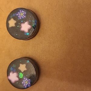Glittery stars in space theme stud earrings